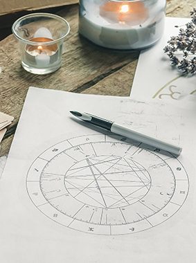 Astrology. Astrologer calculates natal chart and makes a forecast of fate Tarot cards, Fortune telling on tarot cards magic crystal, occultism, Esoteric background. Fortune telling,tarot predictions